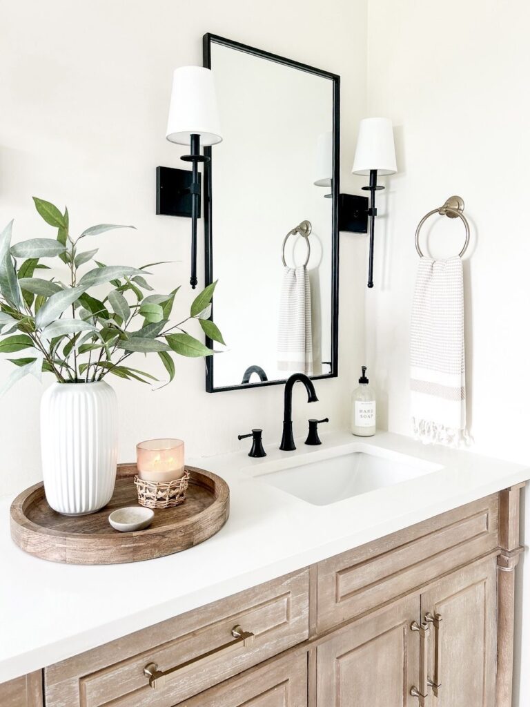 Minimal bathroom counter decor with clean surfaces and intentional styling