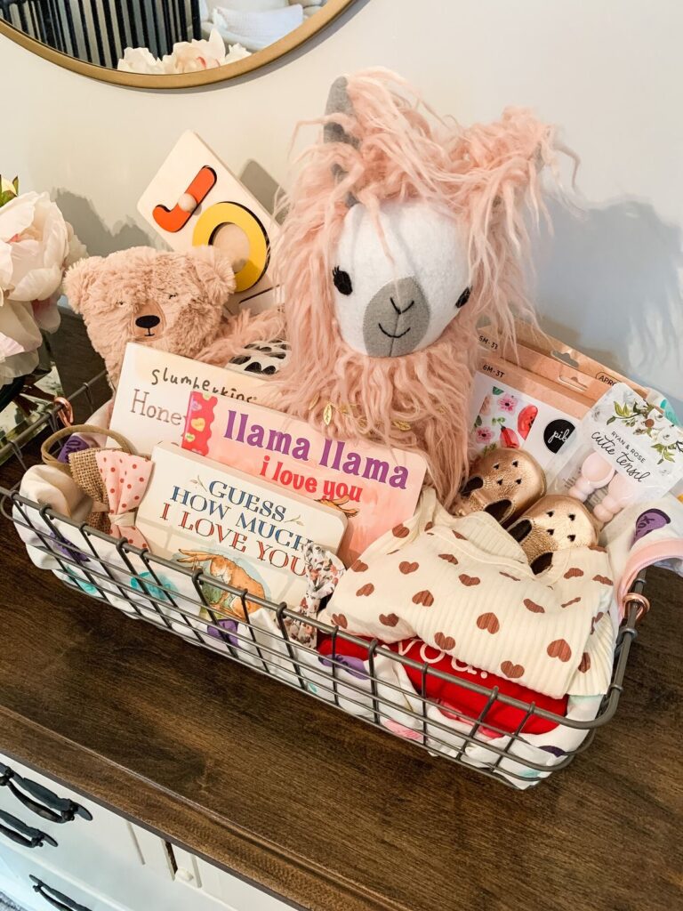 Llama Love book BasketA with llama plush and children’s books in a Valentine’s theme.
